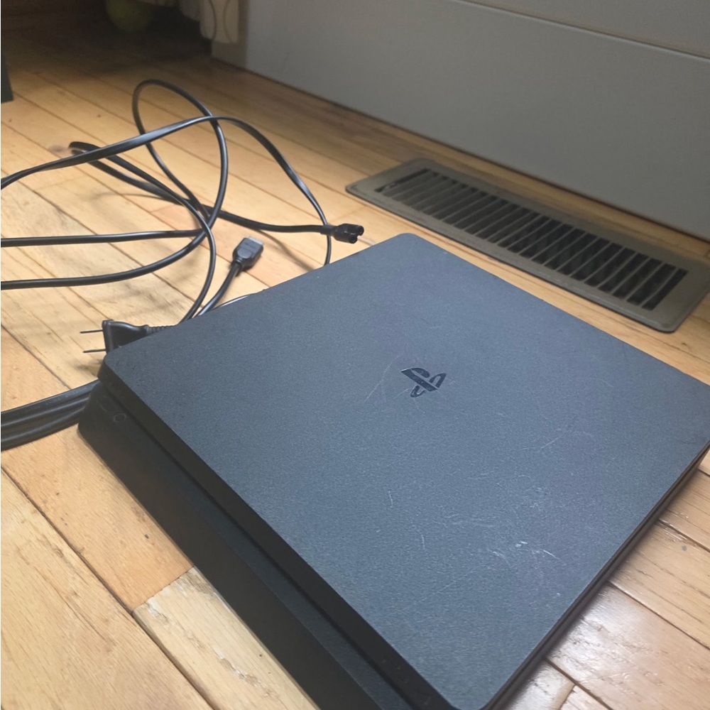 Playstation 4 with original wires, 3 controllers and 2 games.